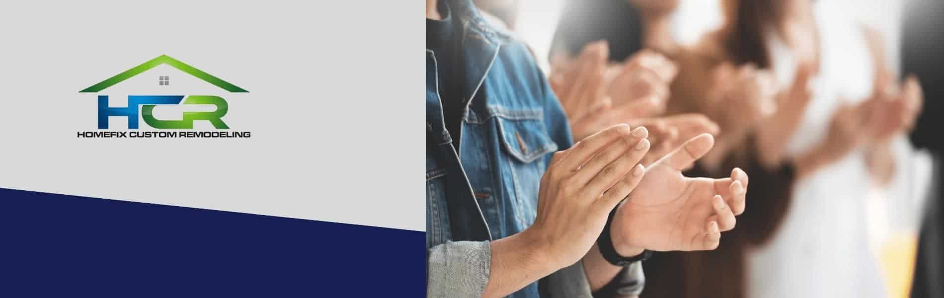 a group of people applauding each other with their hands together.