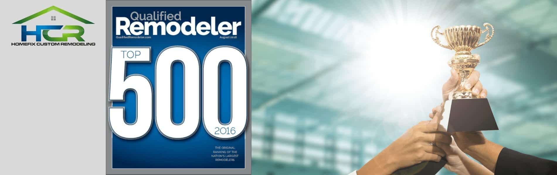 a person holding up a trophy in front of a building.