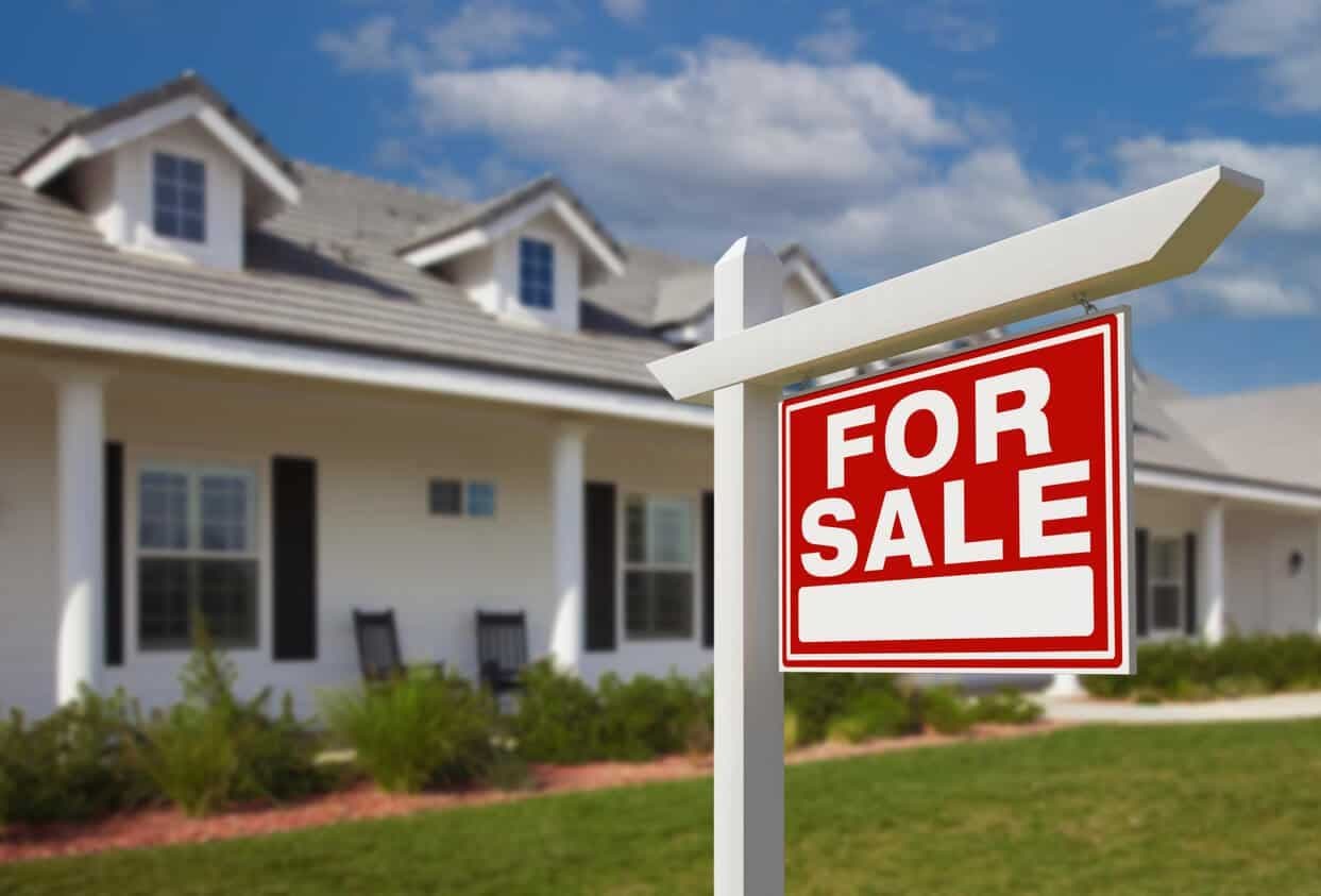 For sale sign advertising a house with a new roof.