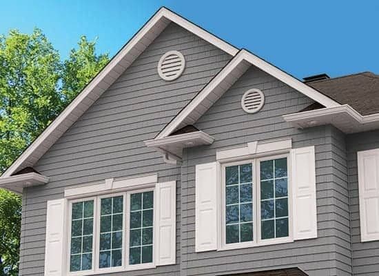 a two story house with new windows