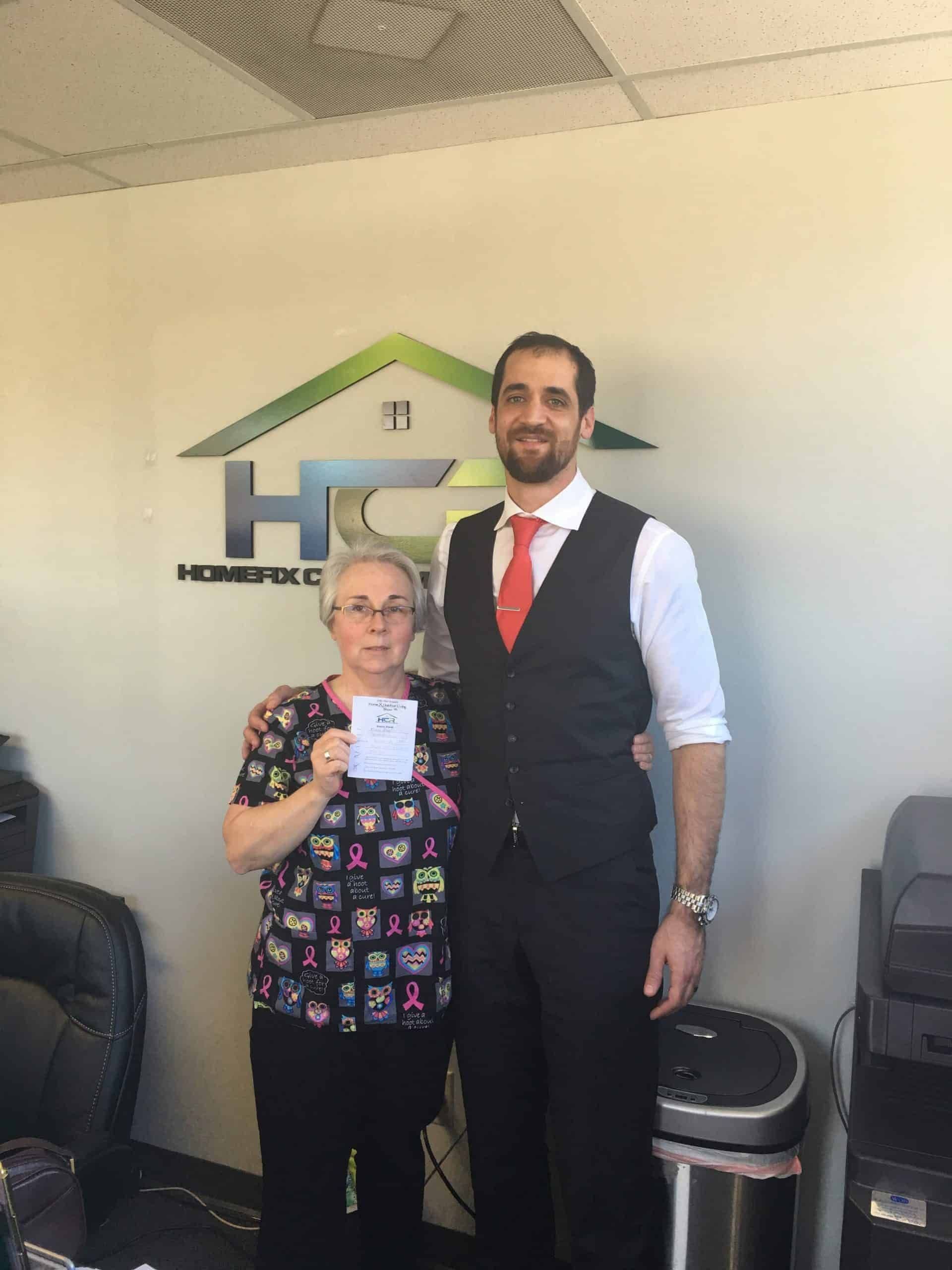 a man and woman standing next to each other.