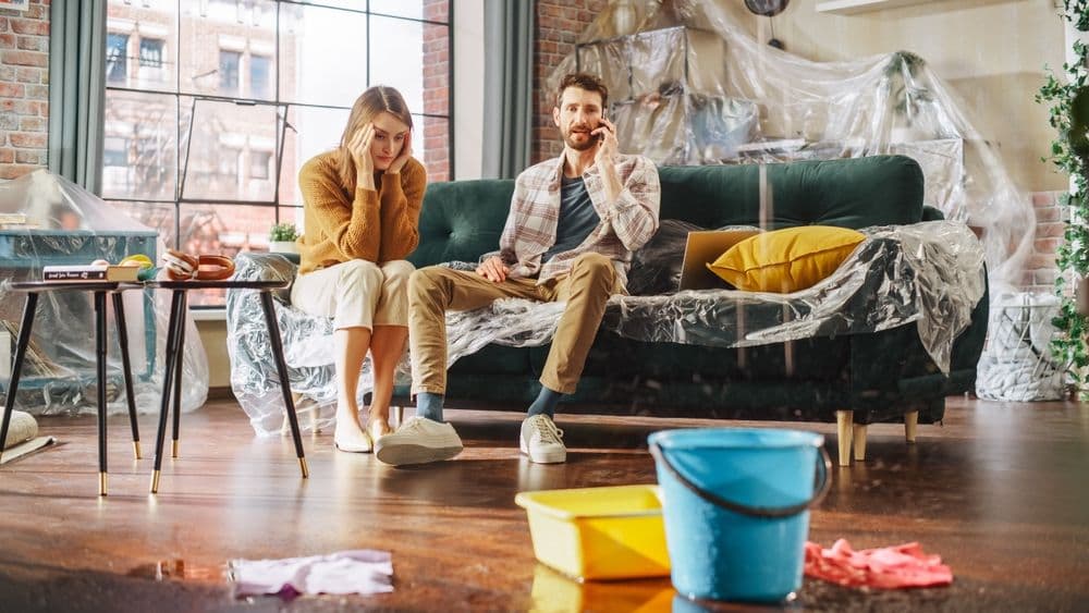 couple trying to solve a roof leak